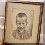 A13. Framed portrait signed J. Mann. 